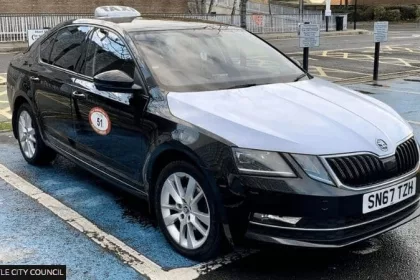 newcastle taxi black car with white bonnet