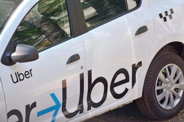 White car with the inscription 'Uber' on its side