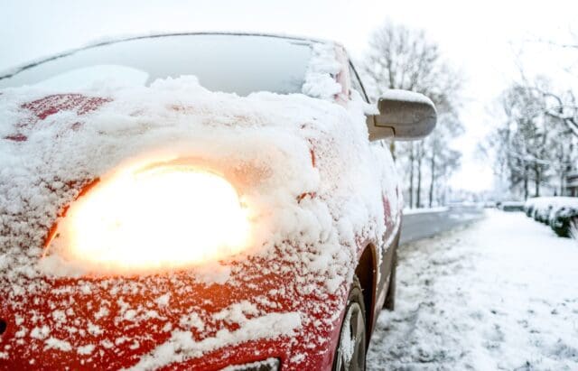 Snow on a car due to winter condition