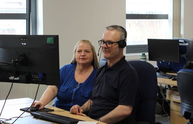 Members of the Patons insurance team working together to help a customer.
