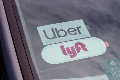 Uber and Lyft stickers displayed in a private hire vehicle