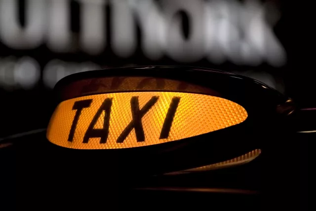 Lit up taxi cab sign