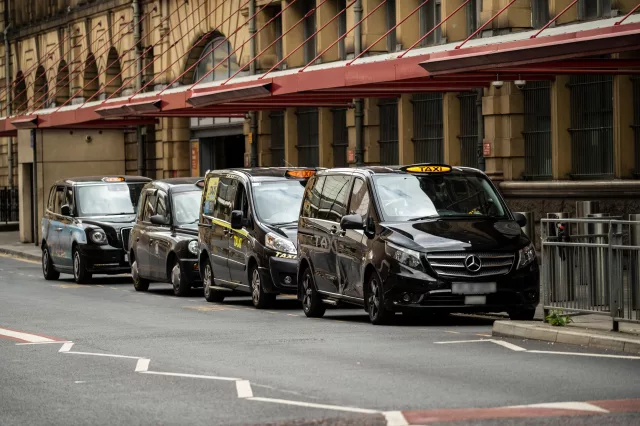 black cab taxis waiting at taxi rank