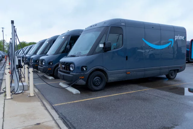 Amazon Prime electric delivery vans at charging stations
