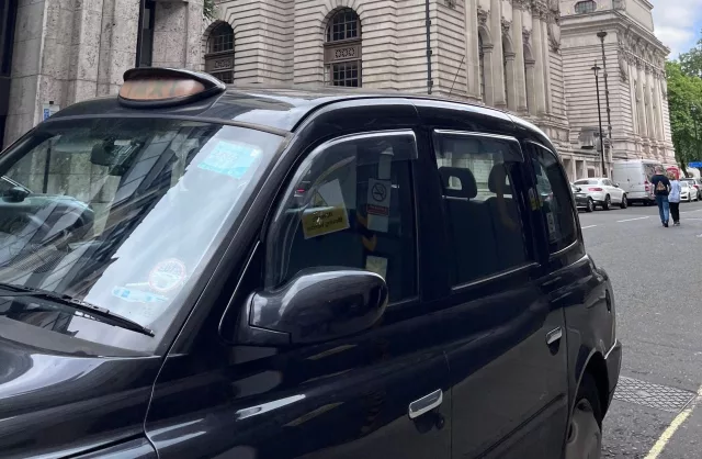Traditional British black taxi cab