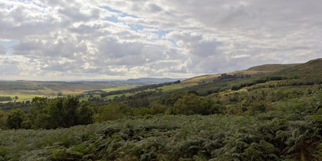 Cloudy day view south-west from the viewpoint in the Campsie Fells at NS 612 801 on the Crow Road, the B822, above Lennoxtown, East Dunbartonshire, Central Scotland,