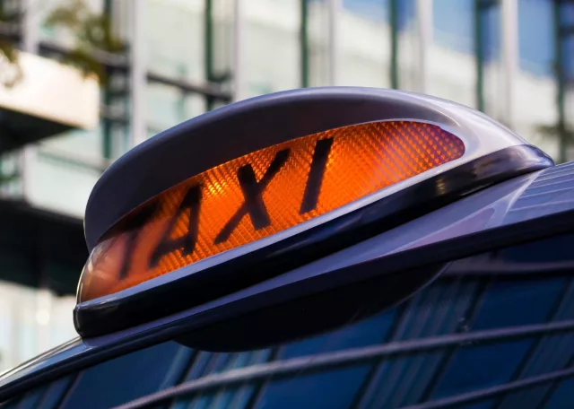 The amber light of a public hire vehicle