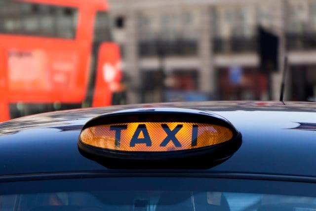 Close up of an illuminated taxi sign