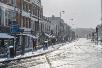 Snowy icy road in the UK. Professional drivers should take extra care driving in winter conditions.