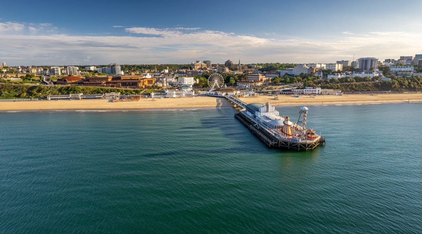 The drone aerial view of the Bournemouth beach, Observation Wheel and Pier. Bournemouth is a coastal resort town in the Bournemouth, Christchurch and Poole council area of Dorset, England.