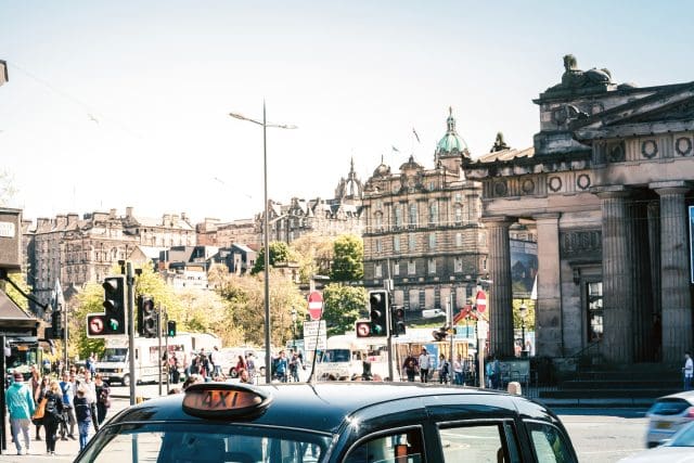 Black cab taxi on Princes Street in Edinburgh, Scotland