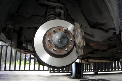 car brakes being fitted in a mechanic's garage