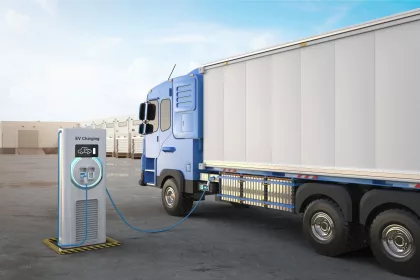 3d rendering of Ev logistic trailer truck or electric vehicle lorry at charging station