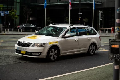 licensed private hire vehicle driving down road