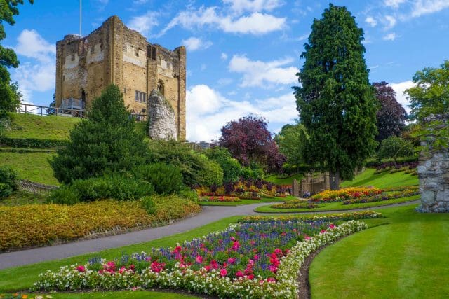 Guildford Castle grounds in Springtime with beds of flowers.