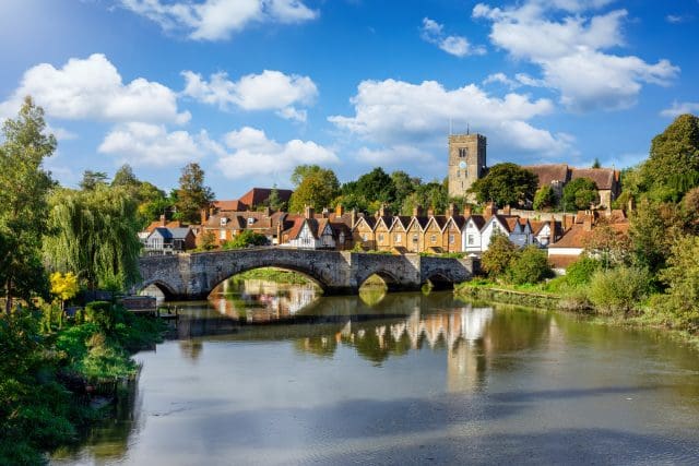Panoramic view of Aylesford village in Maidstone, England with medieval bridge over the river Medway and church