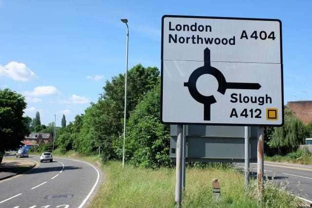 Slough road sign with directions for London Northwood A404 and Slough A412
