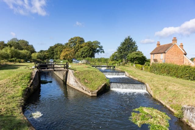 View of historic 17th century Papercourt lock and overspill weir in Woking