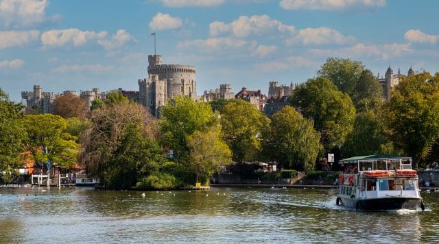 A tourist passenger boat on the River Thames at Windsor, Berkshire, UK.