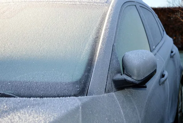 silver car with an icy windscreen