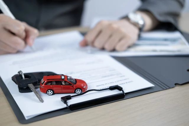 Motor trader signing contract