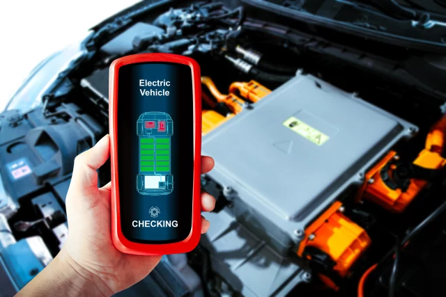 EV battery shown with handheld device displaying the battery charge