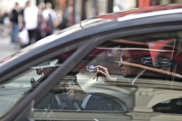 driver smoking inside vehicle