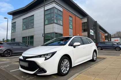 White toyota corolla pictured outside Patons Insurance office