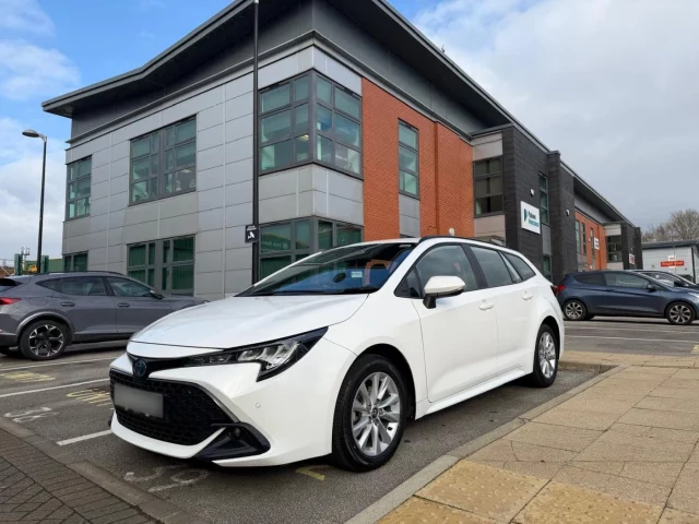 White toyota corolla pictured outside Patons Insurance office