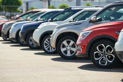 line of cars for sale parked side by side