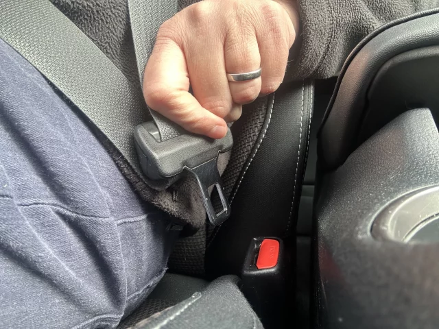 seatbelt being plugged in