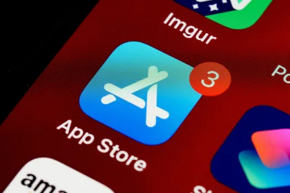 close up of iphone, home screen displaying app store icon