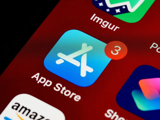 close up of iphone, home screen displaying app store icon