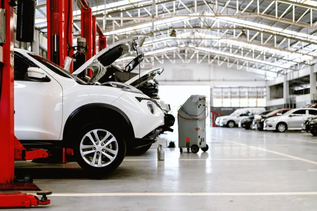 cars being repairs in a service and repair garage