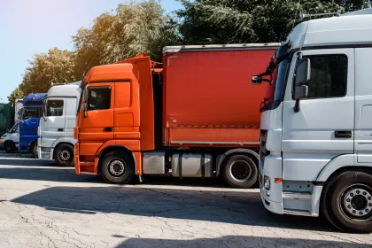 HGVs parked side by side at a service station.