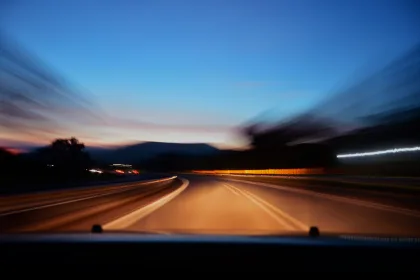 vehicle driving on road at night