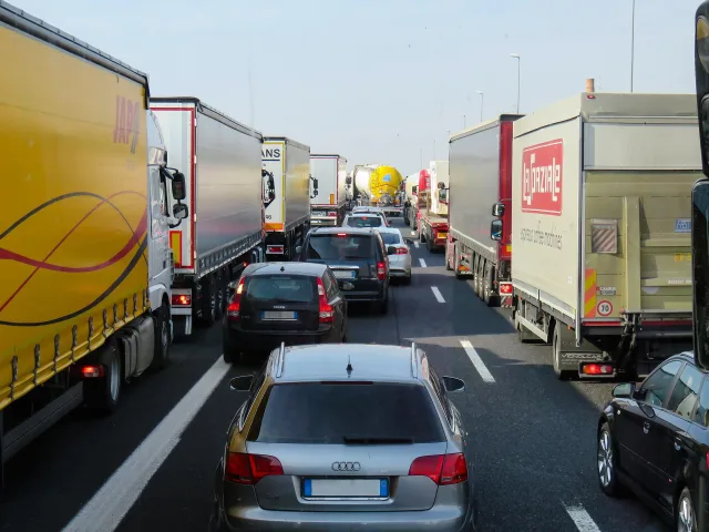 cars and hgvs queueing in traffic on the motorway
