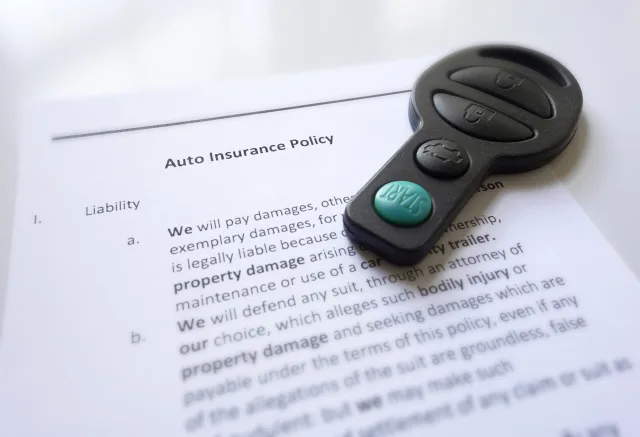 Auto insurance policy and car key