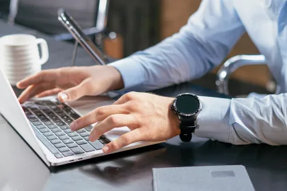 business man typing on laptop