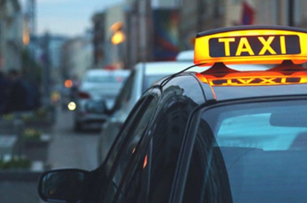 Taxi light on top of saloon vehicle