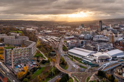 Aerial panorama of Sheffield cityscape skyline at sunset