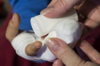 Wrapping an injured hand in a bandage